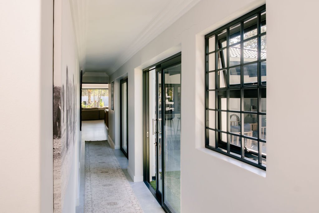 Hallway with aluminium-framed glazing