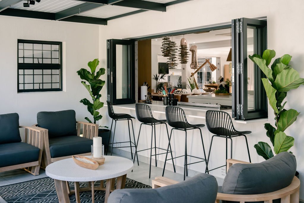 Bi-fold glass open onto bar