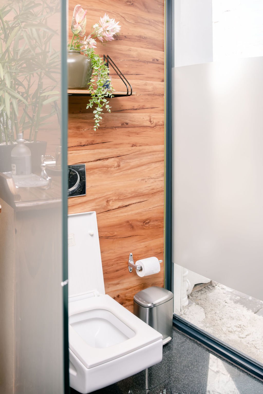Frameless glass shower enclosure